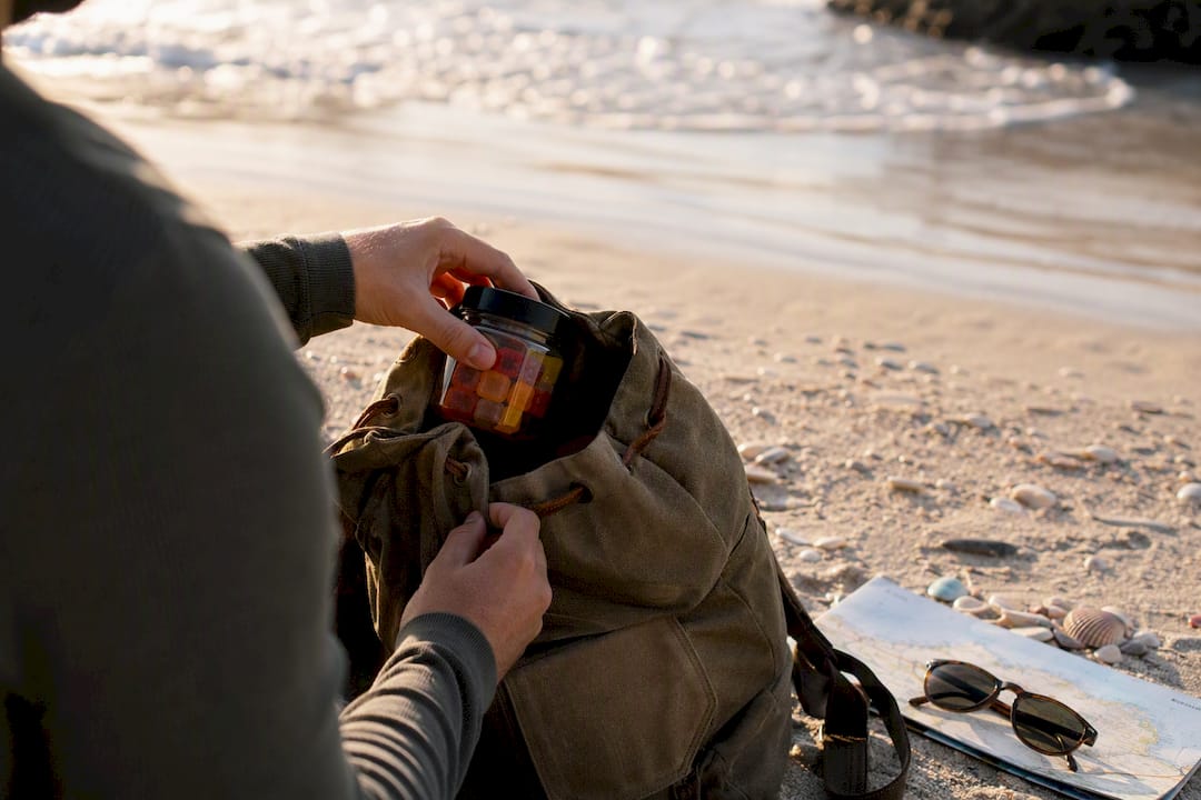 Hand packing hemp gummies in carry-on bag