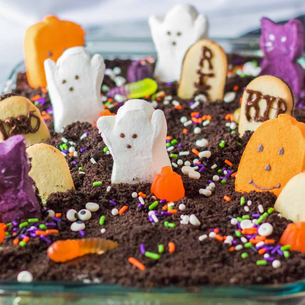 Three black bottles of GhostHemp Ghost Graveyard Gummies 15000mg 30ct are shown in Watermelon Lemonade, Tropical Punch, and Forbidden Razz flavors. Each bottle highlights its Delta-8 THC content from hemp-derived cannabinoids.