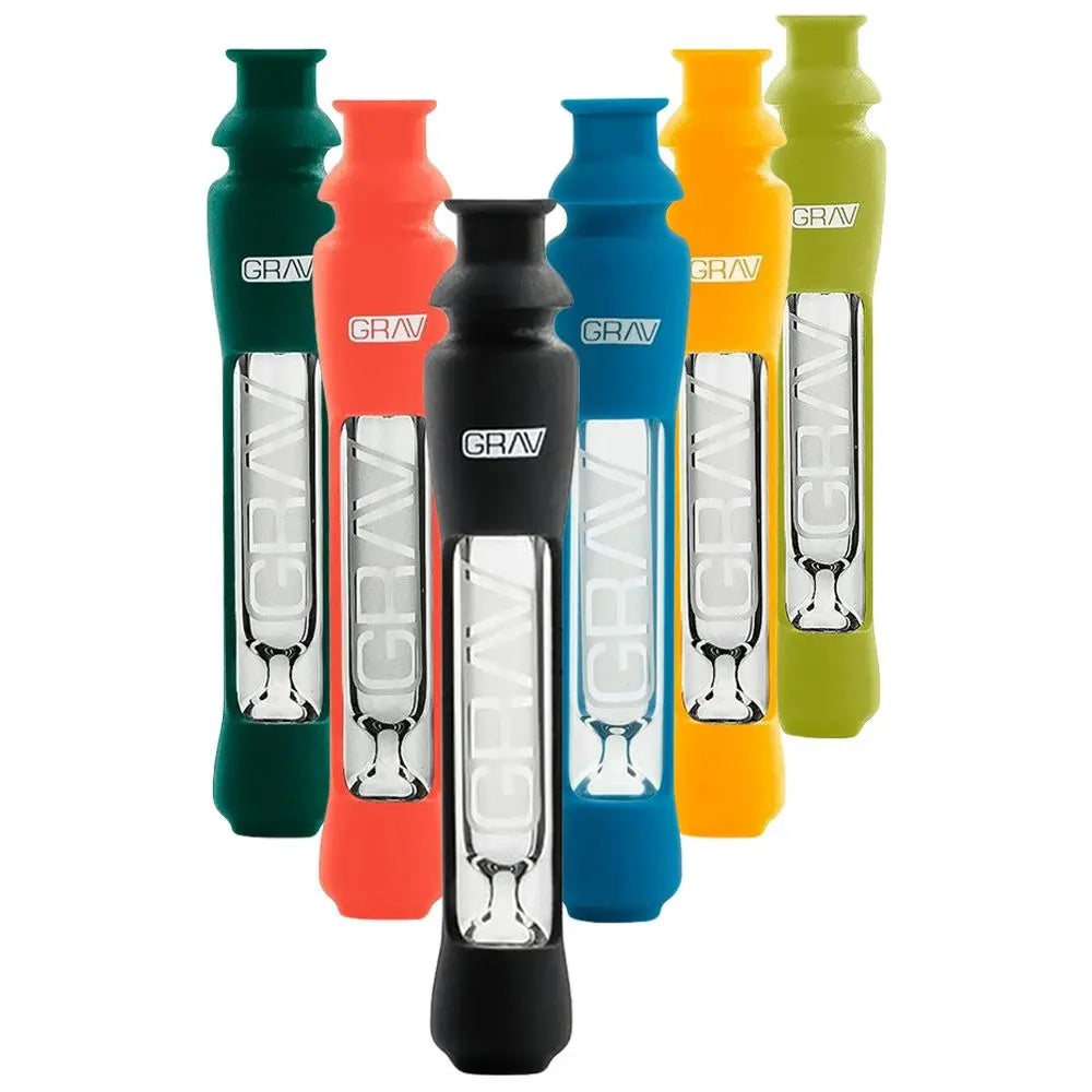 A Grav 12MM Taster w/ Silicone Skin, black and clear glass with "GRAV" printed on the side, is shown upright on a white background with a subtle reflection underneath.