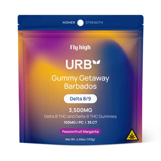 URB Delta-8 & Delta-9 THC Gummies 3500MG by Lifted Made are showcased in vibrant containers and pouches, set against a tropical beach backdrop with rocks, sand, and lush greenery. Now available in a 6-pack display.
