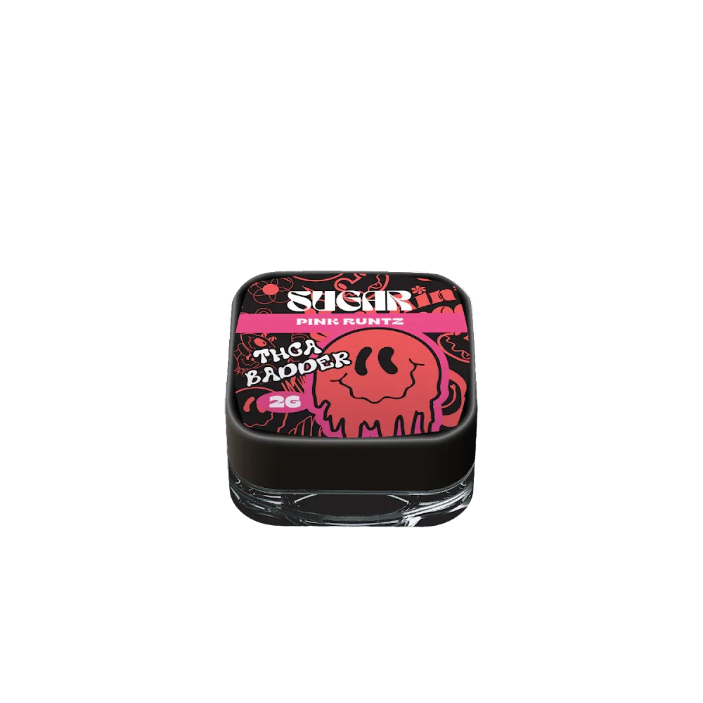 A small glass jar with a black lid, labeled "Trippy Sugar THCa Badder 2G | 5-Pack" by Trippy Sugar, features blue and yellow graphics and contains yellow, crumbly hemp concentrate ideal for dabbing.