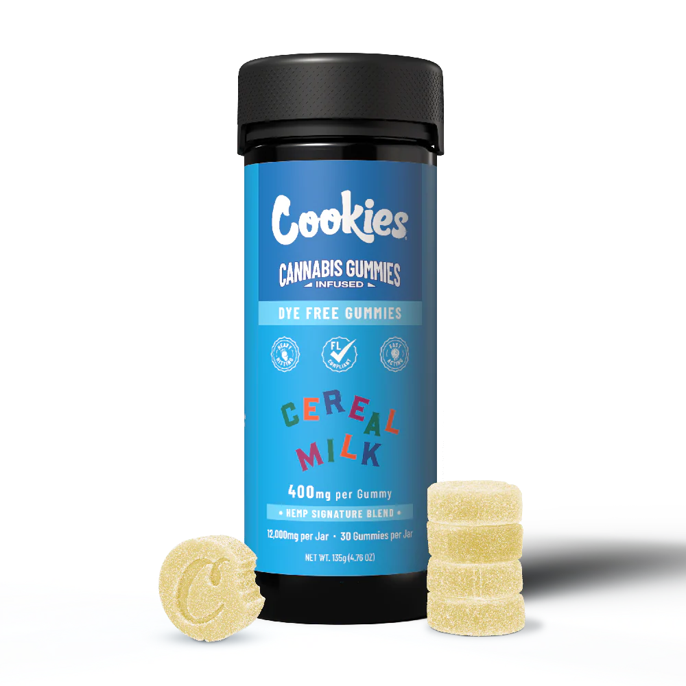 A black jar labeled "Cookies - THCA Delta 9 Special Blend Infused Gummies" in Cereal Milk flavor stands upright, surrounded by four yellow THCa gummies—one embossed with “C.” The label features 400 mg/gummy, dye-free formula, and fast-acting effects.