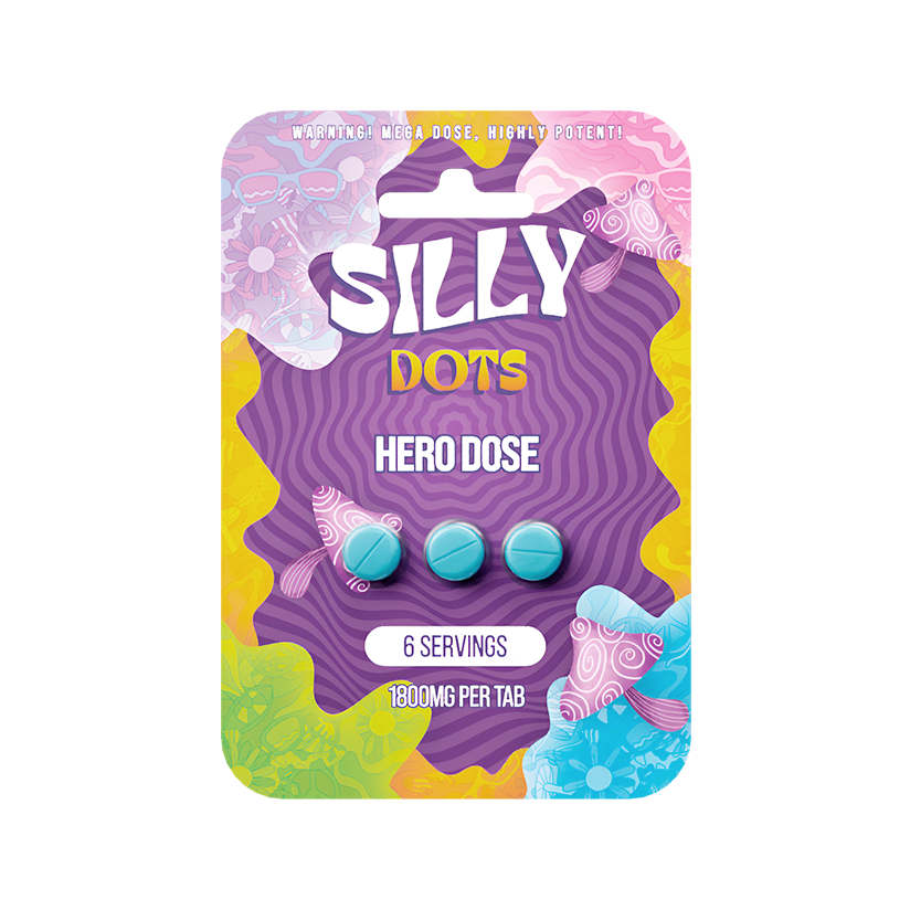 A vibrant, abstract package labeled "Silly Dots Hero Dose 1800mg Per Tablet 3pk" by Silly contains three blue mushroom edible tablets, each with 1800mg. The packaging notes 6 servings and highlights its potent nootropic hero dose.