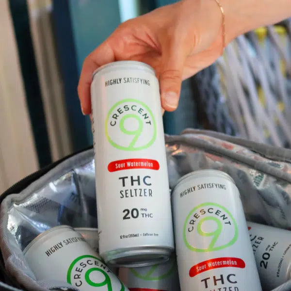 Three cans of Crescent Canna’s Crescent 9 THC Seltzer 20mg in Raspberry Lime, Strawberry Lemonade, and Sour Watermelon. Each sugar-free can contains 20 mg hemp-derived THC and is labeled Highly Satisfying.